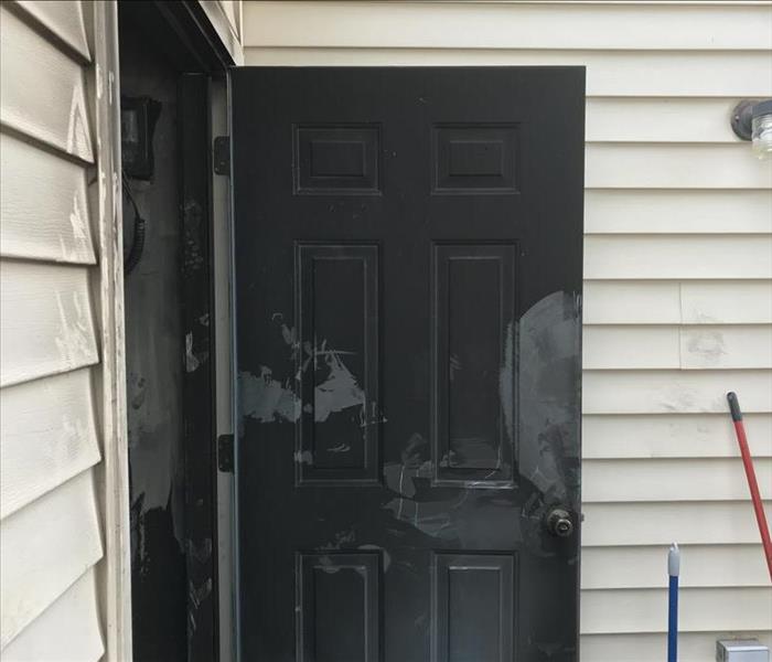 Storage door blackened by soot