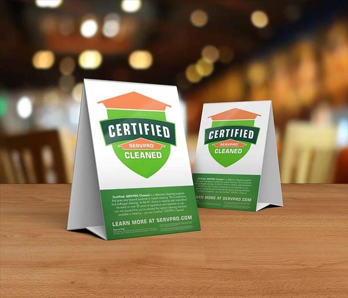 Certified: SERVPRO Cleaned placards on a table